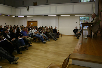 65. Lyn on the stage at right, LYM audience on the left